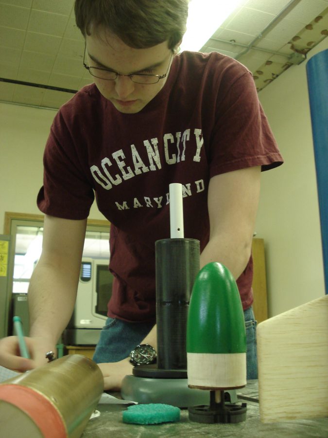 Senior Perry F. works to make small adjustments to their rocket trying to make it perfect for competition. The team hopes to qualify for nationals this year.