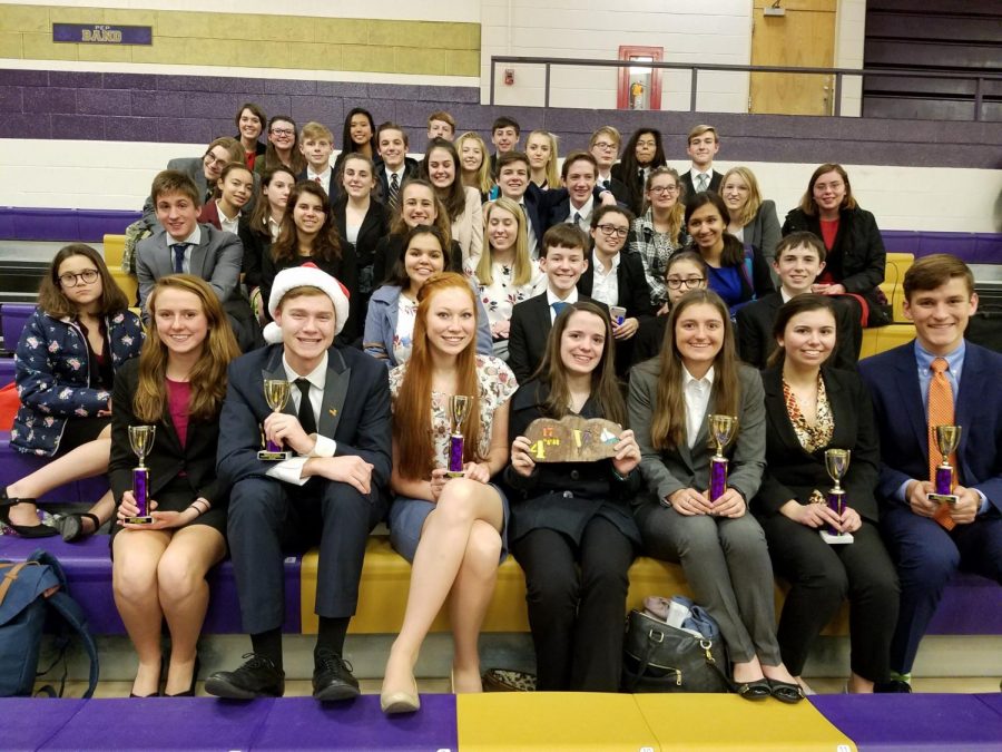 The Speech and Debate team celebrates together with a picture after a tournament. Photo Contributed by: Matt Deters
