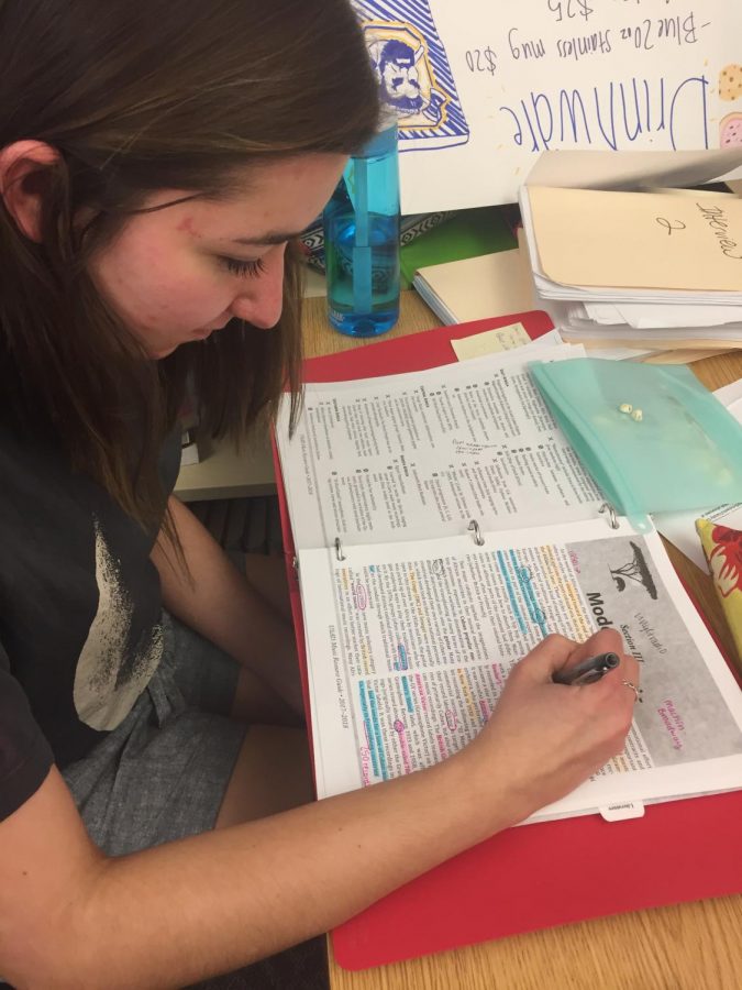 Jordan Neeley (11), a member of the Honors team, studies to prepare for her second Nationals competition.

