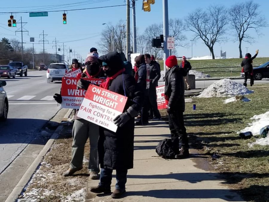 Sidewalk standoff: Union members and supporters participate in picketing for the strike on the Wright State campus.