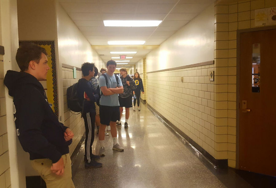 Awaiting assessment: Sophomore students wait outside a classroom to take a state-required English test.