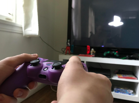Split screens: According to Pew Research Center, 26 percent of surveyed teens believe that they spend too much time playing, while 22 percent believe they are spending too little time playing video games. Photo illustration by: Shayla Frederick.