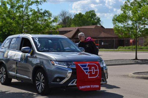 Era ends: Mark Brooks Hedstrom helps with the senior parade on May 26. Photo by: The Ax Staff