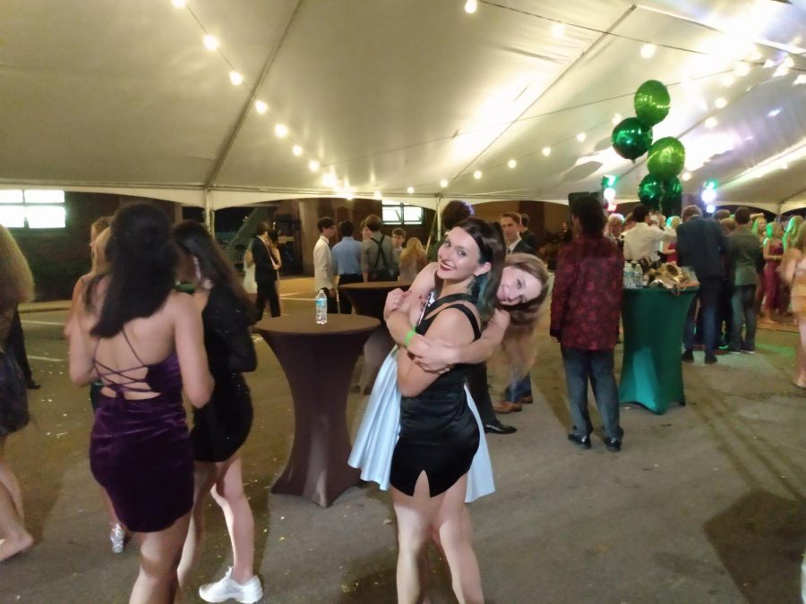 Harmonious Hug: Lilli Jacobsen and Sofia Parrillo continue to enjoy themselves whilst on the outskirts of the dancefloor. Jacobsen (12) said, “I actually liked having the dance outside.”