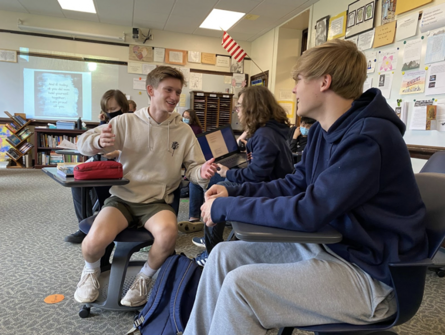 Strong Connection: Benny Caruso (12) and Evan Hiebert catch up in Amy Ostdieks English class, taking the chance to strengthen their bond. “I definitely pay attention to peoples first impressions,” Caruso said. “But if I get a bad vibe, I definitely would remember that.”