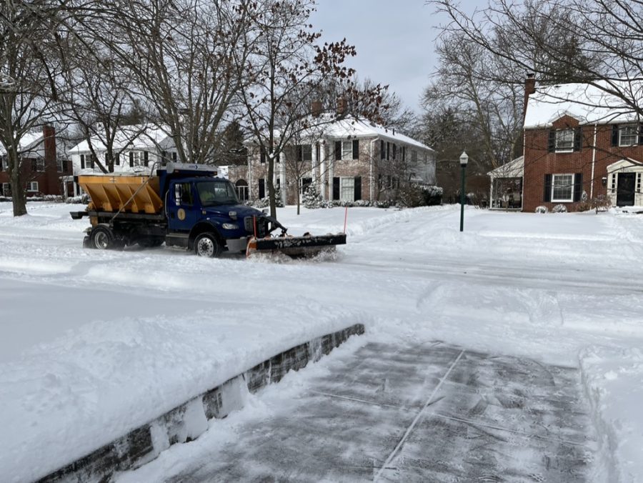 Plow Prank: City of Oakwood maintenance workers plow on Dellwood Avenue, “One snow day a long time ago I got all ready for school and came to school but there was no school and so I went sledding,” Grace McMullen (9) said. Photo by: Adam Chodkowski