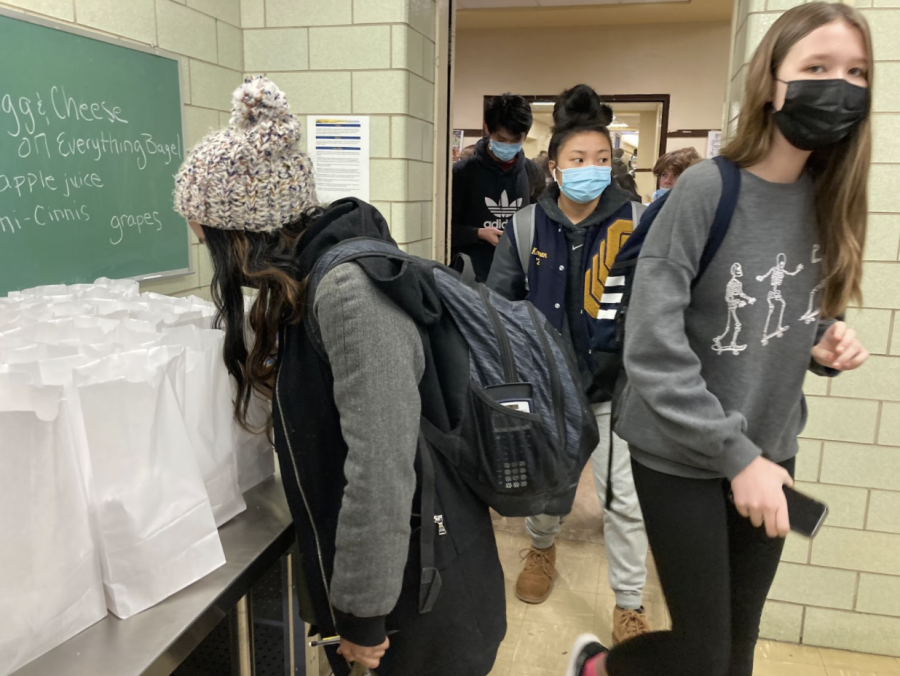 Packing Up: Students walk into the cafeteria to grab their packed lunches. Julia Neal (12) said, “I wanted the catered lunches, absolutely. It’s so much better, and half the food is wasted because people only eat half the lunch.”