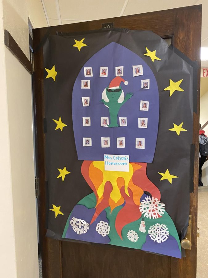 Space+Chase%3A+Kelly+Colson%E2%80%99s+%E2%80%9Cout+of+this+world%E2%80%9D+themed+door+has+each+of+its+students+on+the+space-themed+door.+Colson+said%2C+%E2%80%9CMy+door+is+out+of+this+world%21%E2%80%9D