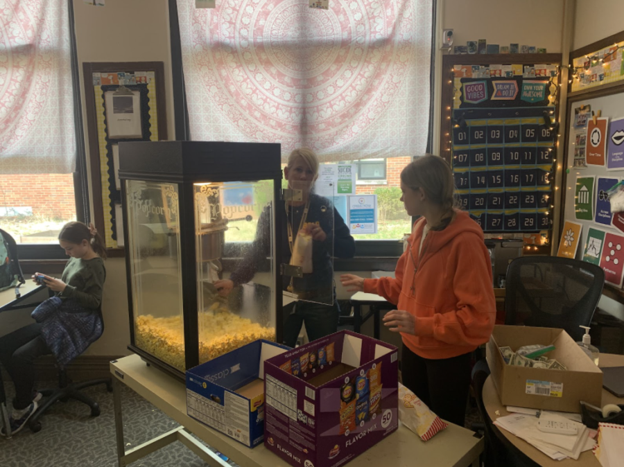 Popcorn Philanthropy: Kim Gilbert, Junior High English teacher, says: “My classes are currently reading a book about refugees and we see the connection. So, my students decided to do this.” Photo by: Yi Yang