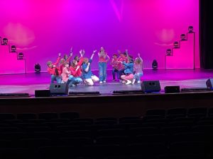 Perfect Performance: Oakwood’s anthem group performs onstage during Acafest on the weekend of Nov. 12, 2022. Lili Kiewitz (9) said, “What was really exciting about this year was that anthem has never participated before…and we got to perform on the big stage!”