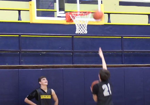 Practice Makes Perfect: The OHS boys varsity basketball team meets in the Oakwood Pit to practice for upcoming games. At the beginning of practice, they have start up drills which get them ready to play for the day. 