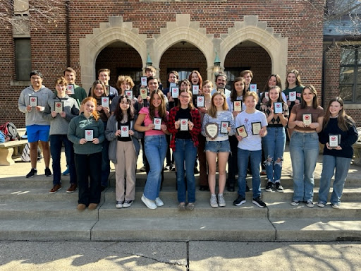 Ready, Smile: Speech and Debate state qualifiers group up for a picture after a hard season of competing and move on to state tournaments. “We’re holding strong together and I think we’ll keep winning,” said Layla Coomer (10). Photo contributed by: Lilly Green. 