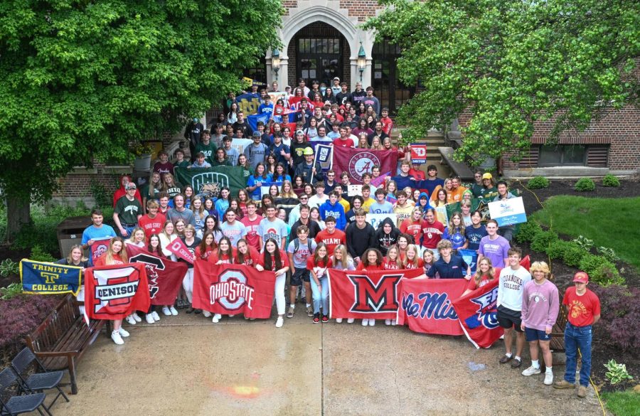 College Rep: Seniors gather outside the school for a group photo, repping the different colleges they plan to attend. Photo by: Easterling Studios