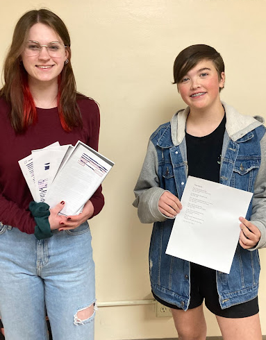 Powerful Poets: Pictured left to right, Callie Hayes (9) and Kate S. (7) holding some of their poetry. A piece of paper and pen is a useful way for them to express their feelings, due to it being a processing tool for events or emotions.  