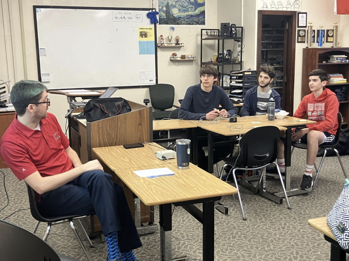 Further Practice: Matthew Drummond (10), Eden Lubow (10) and Seth Schwartz (9) listen intently to Coach Ian Callon’s directions at a quiz team practice during lunch on Jan. 12.