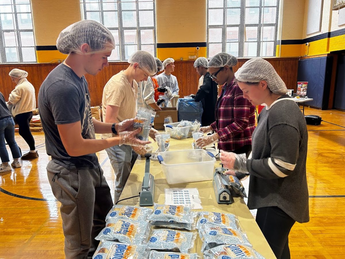 Students pack meals late saturday as part of the intiative