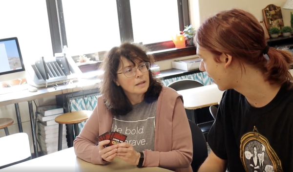 Amy Ostdiek plays Uno with Willow Staley in Kelly Colson's advisory on Sept. 11.